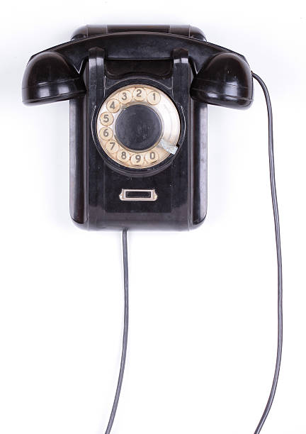 istock Old phone closeup isolated on white background 490555900