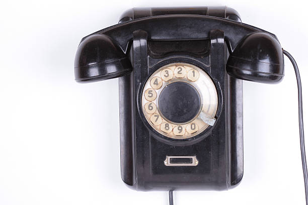 istock Old phone closeup isolated on white background 490555914