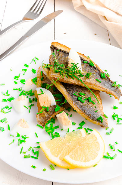 istock Fried Dorada Fillet with egg, chives and thyme 490556097