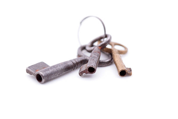 istock Old key closeup isolated on white background 490556132