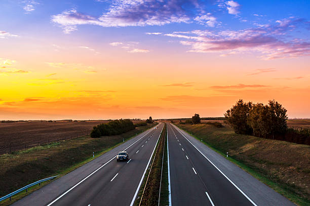 istock Cars speeding on a highway 490556319