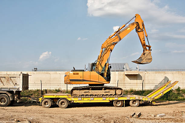 construction machine on flatbed