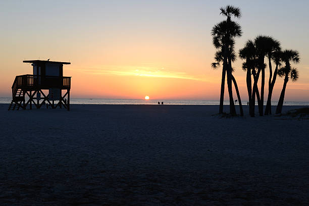 istock Lighthouse Shack and Palm Trees at Sunset 490557517