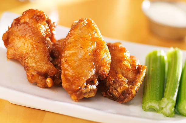 istock buffalo wings with celery and ranch dip 490557629