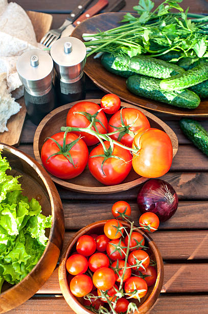 istock Homegrown vegetables in wooden dishware for spring picnic. 490557689