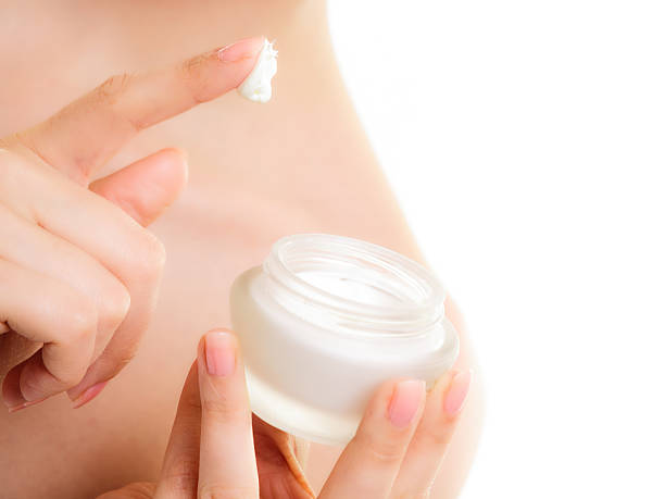 istock Skin care. Moisturizing cream in female hands 490558529