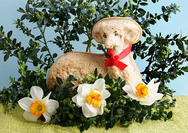 istock easter decoration,with dough baked lamb and spring flowers 490558771