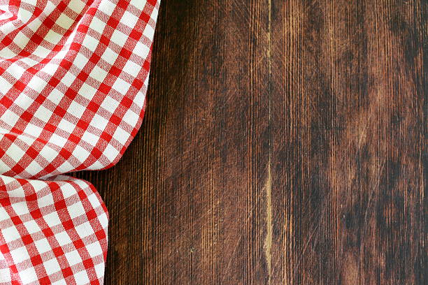 istock Wooden background with red checkered kitchen towel 490559983