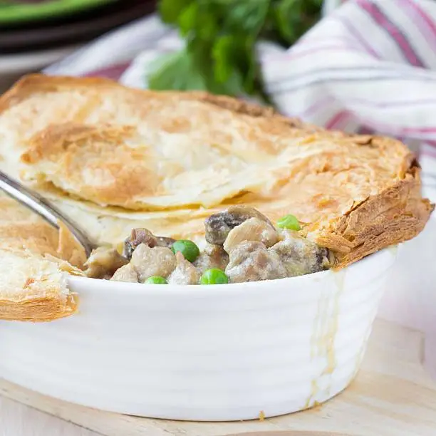 Photo of Meat pie with stew of chicken, mushrooms, peas, puff pastry