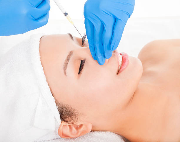 istock Woman is doing cosmetic surgery injections 490560995
