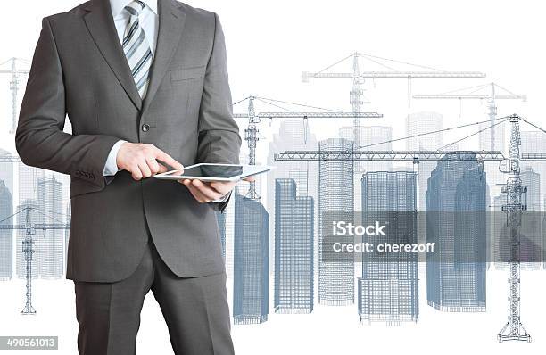 Businessman In Suit Hold Tablet Pc Stock Photo - Download Image Now - Construction Industry, Wire-frame Model, Abstract