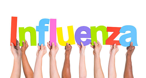 istock Diverse Hands Holding The Word Influenza 490575051