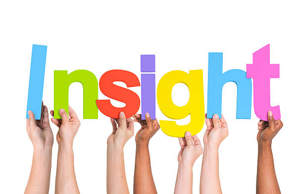 istock Multiethnic Group of Hands Holding Word Insight 490575059