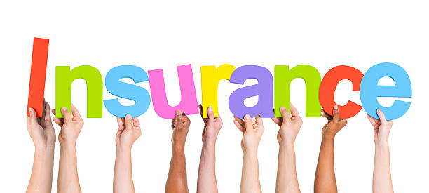 istock Diverse Hands Holding The Word Insurance 490575079