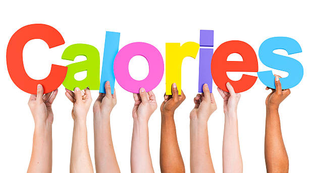 istock Diverse Hands Holding The Word Calories 490575323