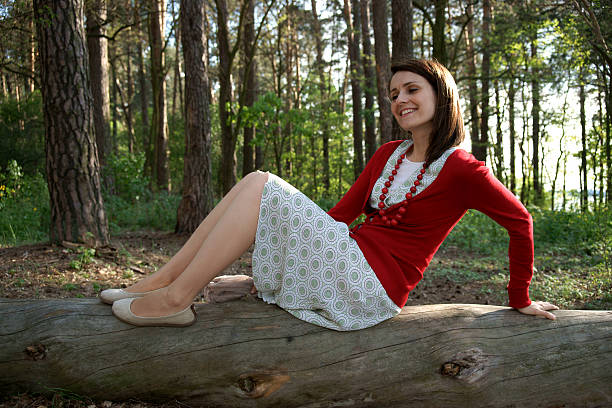 Woman on old trunk stock photo