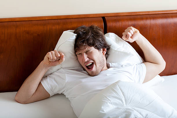 istock Yawning man after awakening 490577543