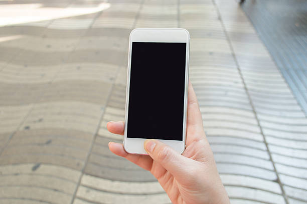 istock using the smartphone at the ramblas barcelona spain 490578122