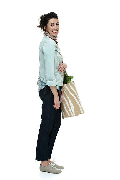 istock Cheerful woman holding vegetable bag 490579883