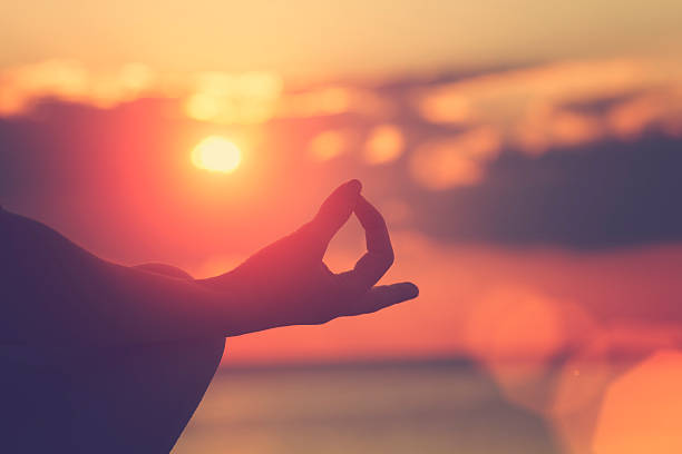istock Young woman practicing yoga on the beach. 490580830