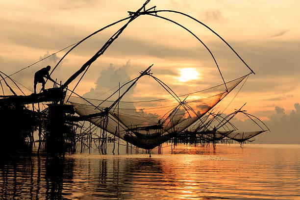 istock Traditional asia fishing net on sunrise. 490580975