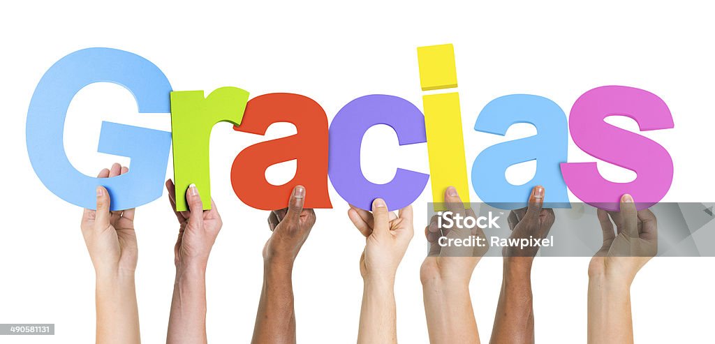 Multiethnic Group of Hands Holding Word Gracias Multiethnic Group of Hands Holding Gracias Thank You - Phrase Stock Photo