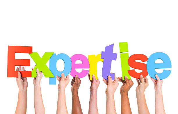 istock Diverse Hands Holding The Word Expertise 490581159