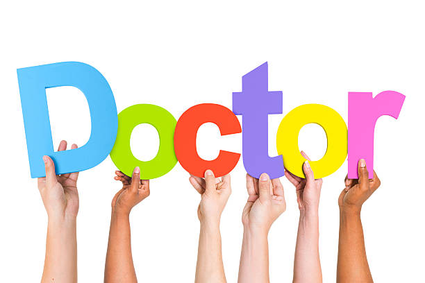 istock Diverse Hands Holding The Word Doctor 490581167
