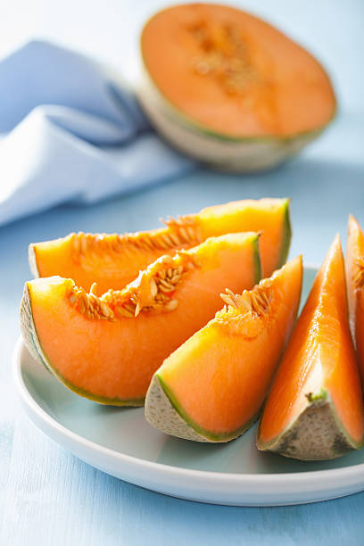 istock cantaloupe melon sliced on blue plate 490581172