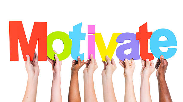 istock Multiethnic Group of Hands Holding Word Motivate 490581277