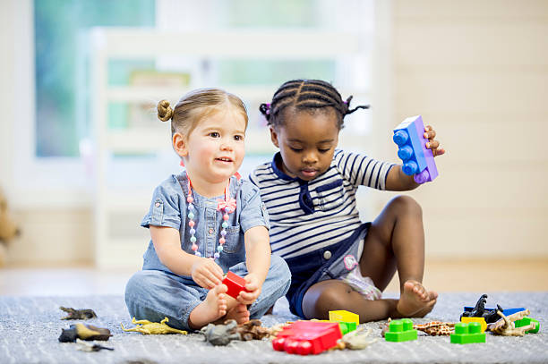 istock Children with Blocks and Plastic Animals 490581484