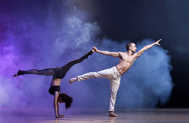 Contemporary Dance Sensual couple performing an artistic and emotional contemporary dance. contemporary dance stock pictures, royalty-free photos & images