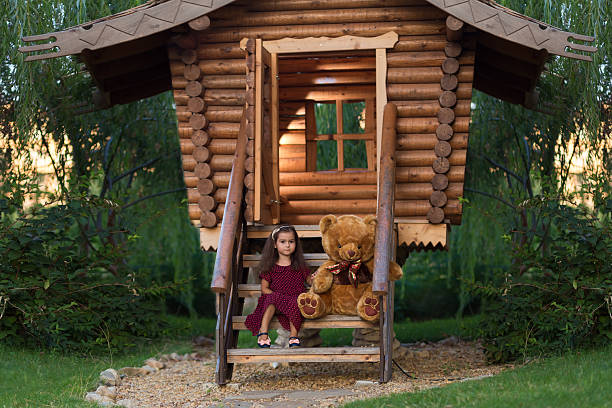 istock Little girl with a teddy bear 490584216