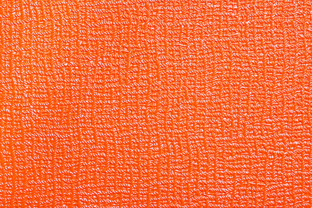istock orange background material tolex closeup 490586994