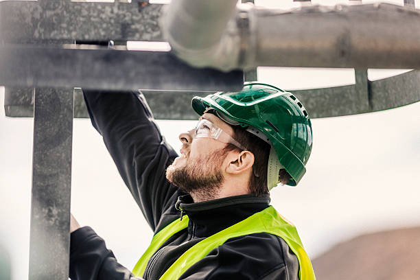 istock Manual worker climbing ladder in factory 490592480