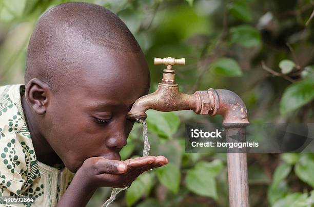 Social Issues African Boy In Need For Clean Water Stock Photo - Download Image Now - Africa, Water, Poverty
