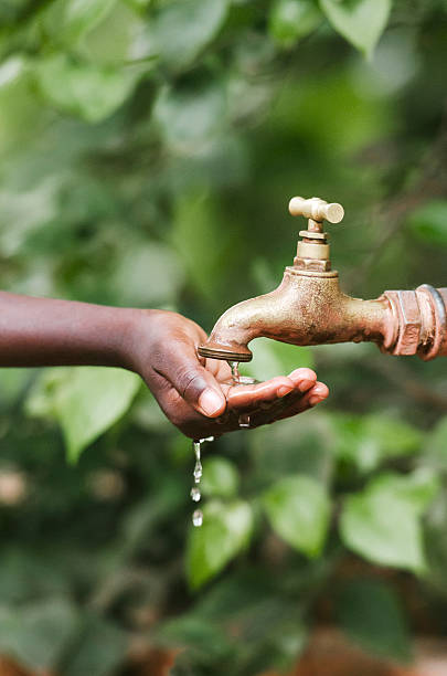 istock Hands Cupped Under Water Scarcity Symbol Drought Thirsty Africa 490606822