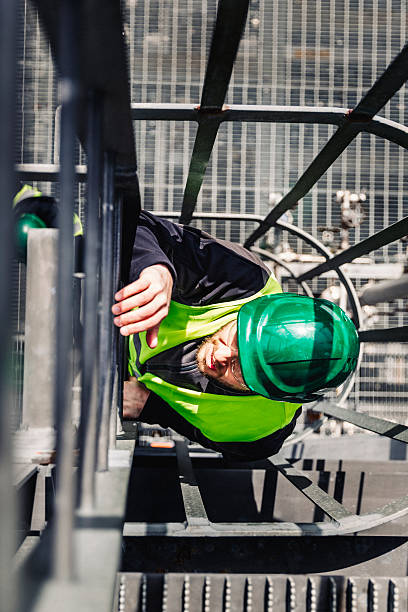 istock Male technician climbing ladder in industry 490607092