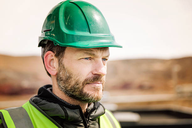 istock Thoughtful manual worker outside factory 490607860