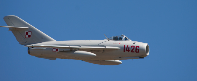 Hillsboro, United States- August 4, 2012:  The Oregon International Airshow is a 3 day event in Hillsboro, Oregon. This image shows a vintage Mikoyan-Gurevich MiG-17 aircraft flying over the show.