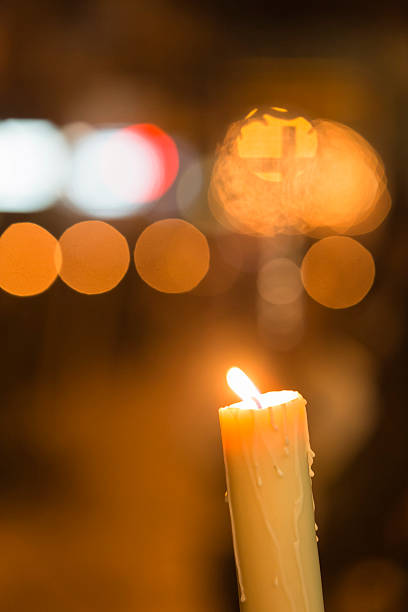 istock Candle light with light bokeh in the background 490609909