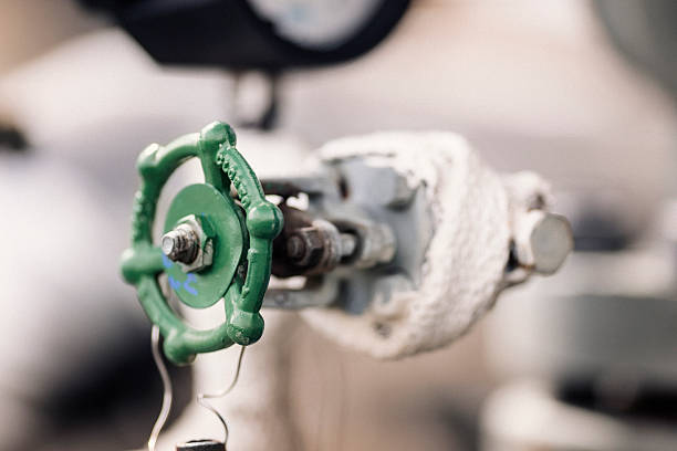 istock Metallic green valve in factory 490611094