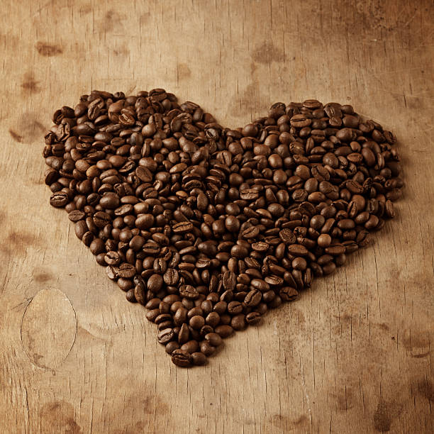 istock heart fron coffee beans, on wooden surface 490612293