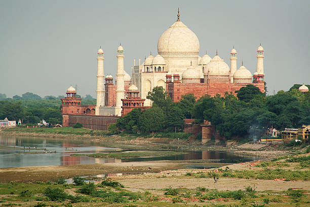 The view of Taj Mahal from the Agra Fort (Moti Masjid) across the Yamuna River, Taj Mahal, the iconic landmark of Agra India.