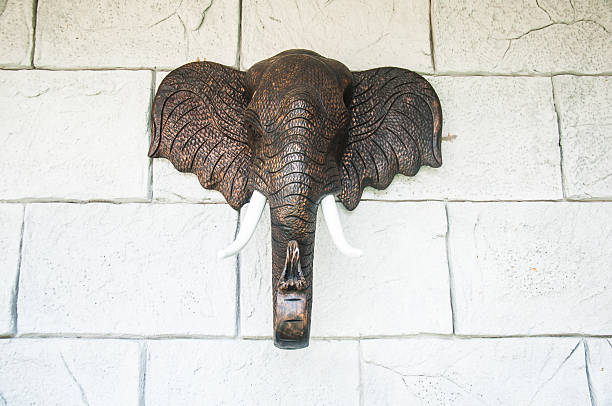istock ancient wood carving elephants 490612944
