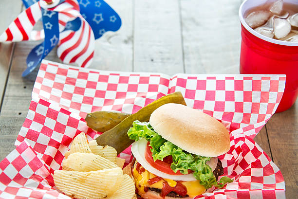 istock Cheeseburger loaded with toppings in a patriotic theme 490613075