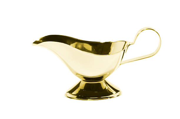 istock Old-fashioned antique precious golden sauce boat 490614277