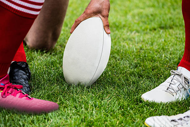 istock Rugby players in huddle with ball 490614600