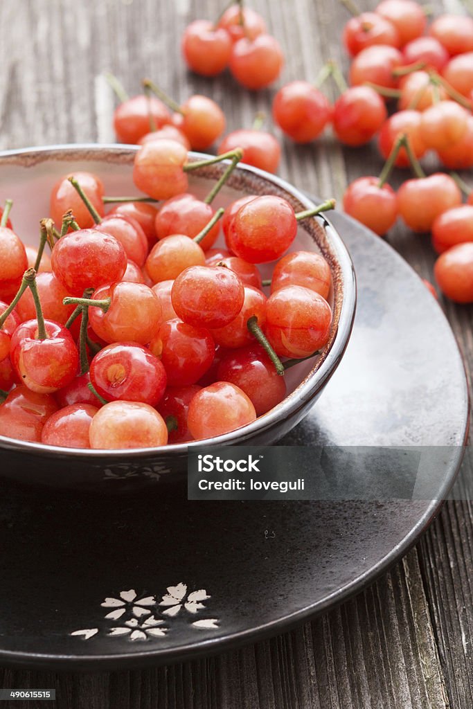 Fresh cherries in bowl on table Agriculture Stock Photo