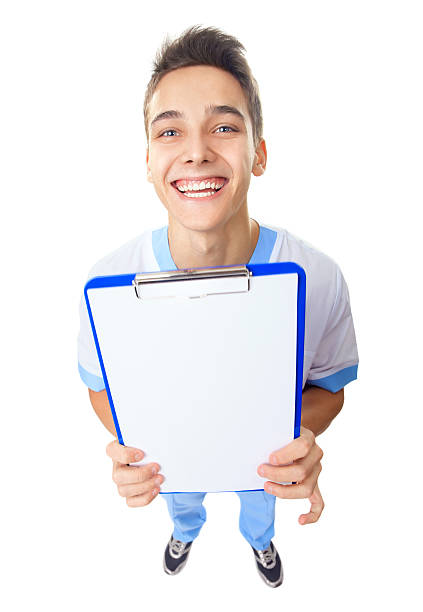 istock Laughing young doctor showing empty clipboard 490615781